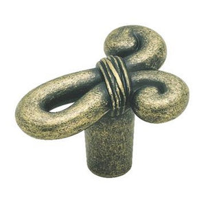 Antique brass knob shaped like a knot in weathered brass finish